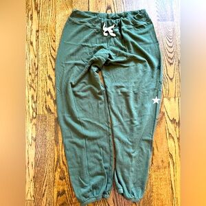 Sundry green joggers with stars. Size 3 (Large)